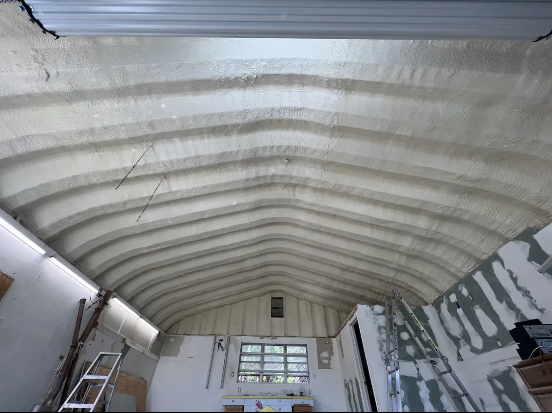 Spray polyurethane foam applied to the underside of a metal roof deck in Fremont